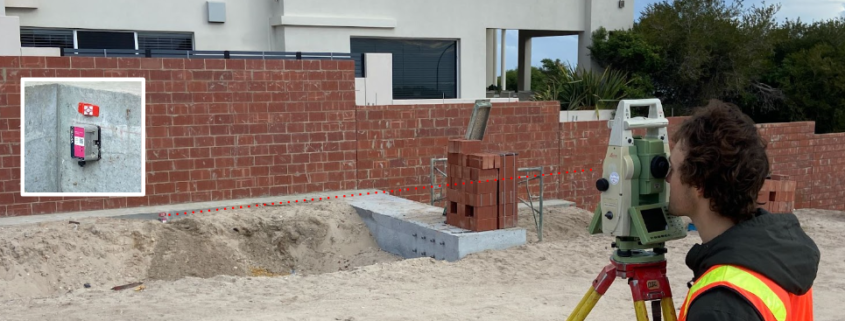 A retaining wall undergoes surveying to assess its stability as a part of Monitel's Strategic Partnership with Opifex Geotechnics in Perth.