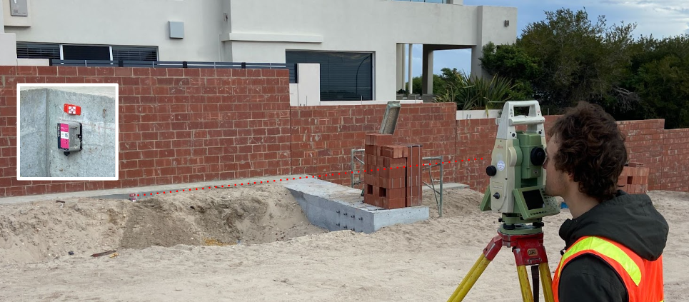 A retaining wall undergoes surveying to assess its stability as a part of Monitel's Strategic Partnership with Opifex Geotechnics in Perth.